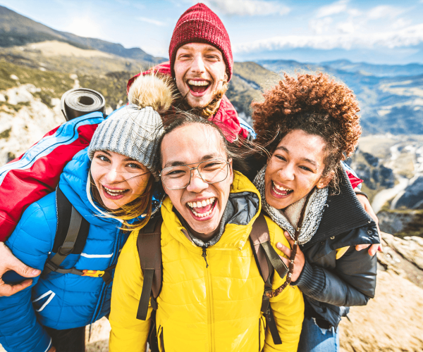 multiracial-group-of-young-people-hiking-mountains-2025-02-10-11-18-18-utc